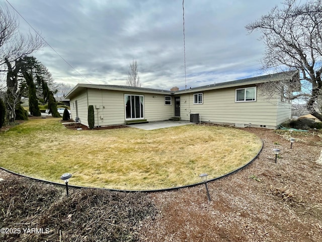 rear view of house featuring a patio, fence, central AC unit, and a lawn