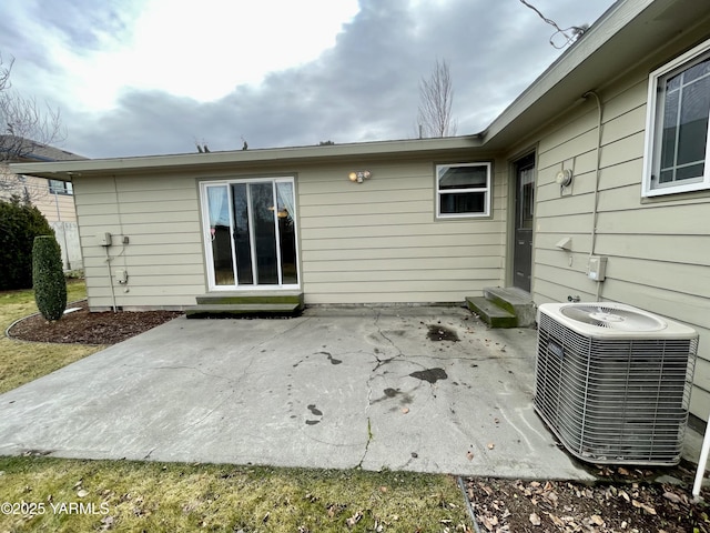 back of property featuring entry steps, a patio area, and central AC unit