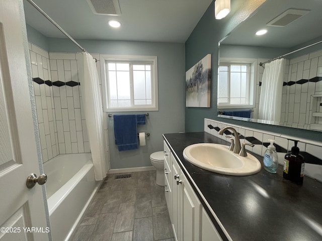 bathroom featuring visible vents, vanity, and toilet