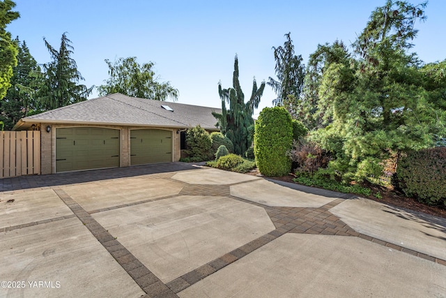 view of front of home with concrete driveway, brick siding, a shingled roof, and a garage