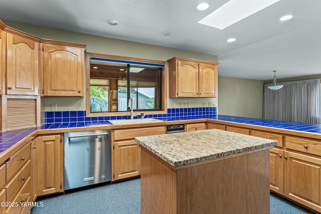 kitchen with a sink, dark colored carpet, recessed lighting, stainless steel dishwasher, and a skylight