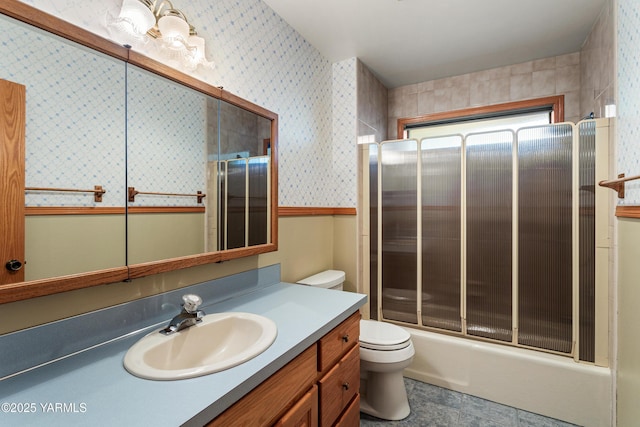 full bath with vanity, wallpapered walls, and toilet