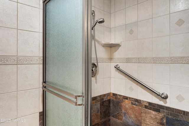 full bath with a shower stall
