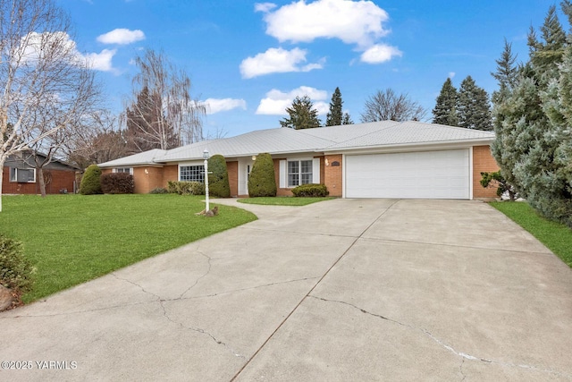ranch-style home featuring an attached garage, a front lawn, brick siding, and driveway
