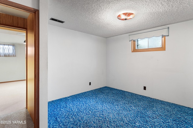 6520 Barge St, Yakima, WA 98908 - carpeted empty room featuring a textured ceiling, a wealth of natural light, and visible vents