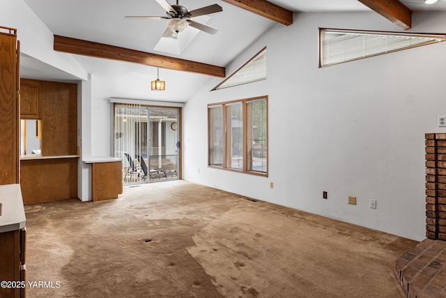 6520 Barge St, Yakima, WA 98908 - unfurnished living room featuring carpet, beam ceiling, a skylight, visible vents, and a ceiling fan