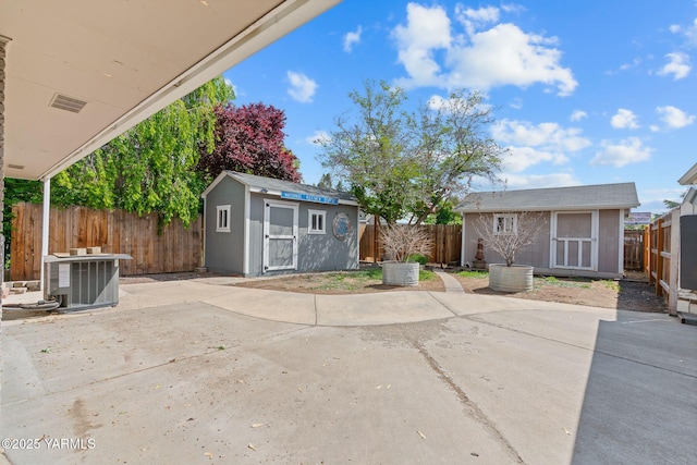 419 S 58th Ave, Yakima, WA 98908 - view of front of home with cooling unit, a patio area, and a fenced backyard
