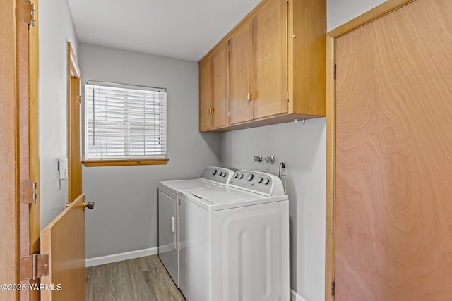 419 S 58th Ave, Yakima, WA 98908 - laundry room with cabinet space, washer and dryer, light wood finished floors, and baseboards