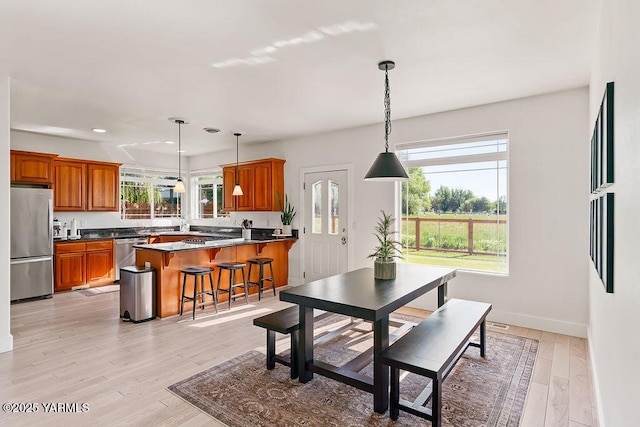 703 S 87th Ave, Yakima, WA 98908 - dining room with plenty of natural light, light wood-type flooring, baseboards, and recessed lighting