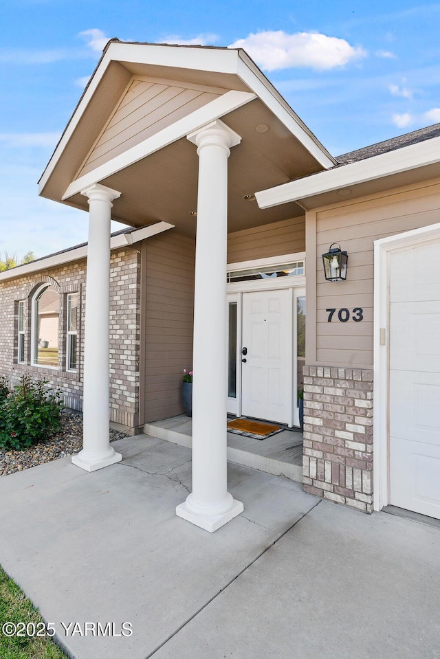 703 S 87th Ave, Yakima, WA 98908 - property entrance with brick siding and covered porch
