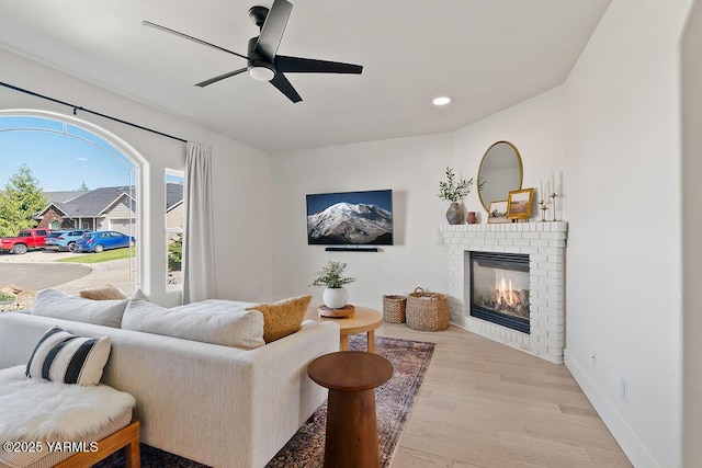 703 S 87th Ave, Yakima, WA 98908 - living room featuring a ceiling fan, light wood finished floors, a fireplace, baseboards, and recessed lighting