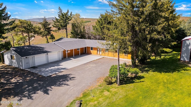451 Pleasant Valley Pl, Yakima, WA 98908 - ranch-style house with concrete driveway, fence, a front lawn, and a garage