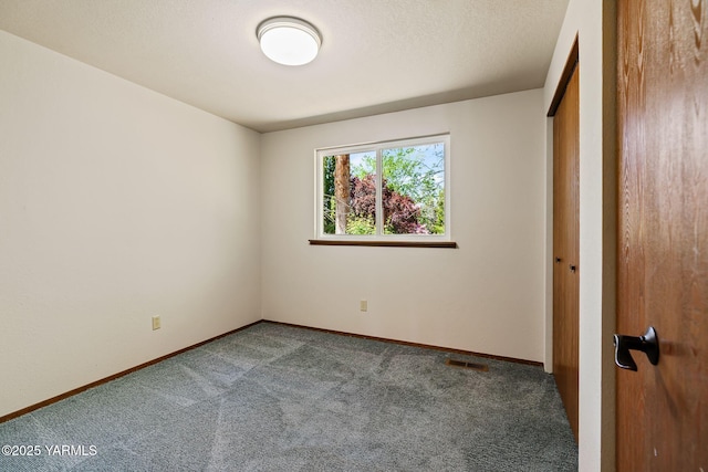 451 Pleasant Valley Pl, Yakima, WA 98908 - unfurnished bedroom with carpet floors, baseboards, and visible vents