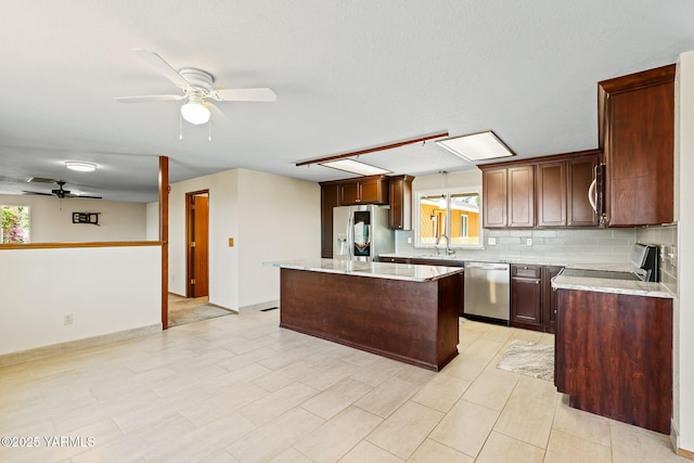 451 Pleasant Valley Pl, Yakima, WA 98908 - kitchen with plenty of natural light, ceiling fan, a kitchen island, and stainless steel appliances
