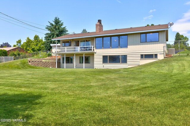 5306 Douglas Dr, Yakima, WA 98908 - rear view of property with a chimney, a balcony, and central AC unit