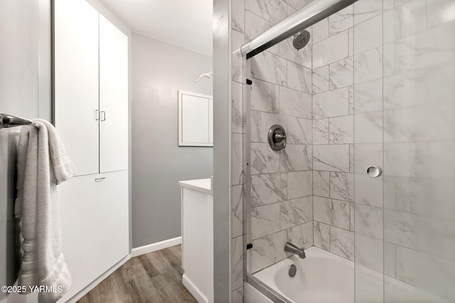 5306 Douglas Dr, Yakima, WA 98908 - full bathroom featuring wood finished floors, shower / washtub combination, baseboards, and vanity