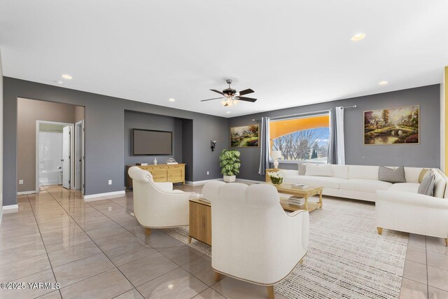 living room with light tile patterned floors and recessed lighting