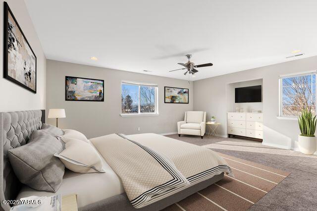 bedroom with carpet, a ceiling fan, and baseboards