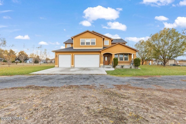 view of front of home with an attached garage, a front lawn, concrete driveway, and stucco siding