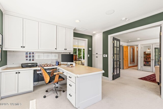 office area with light colored carpet, crown molding, built in desk, recessed lighting, and baseboards