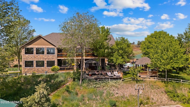 12900 Douglas Rd, Yakima, WA 98908 - rear view of house with stone siding, a deck, and a gazebo