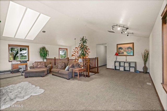 12900 Douglas Rd, Yakima, WA 98908 - living area with lofted ceiling, carpet, and a skylight
