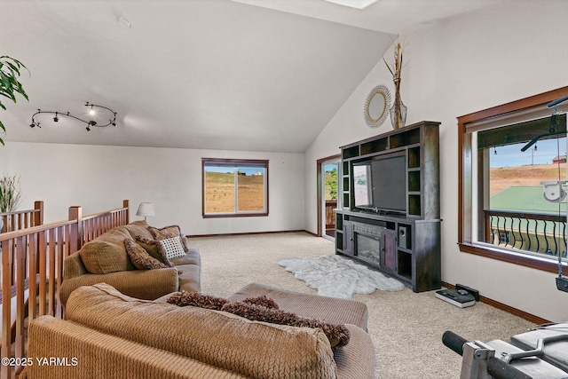 12900 Douglas Rd, Yakima, WA 98908 - living room with carpet, healthy amount of natural light, baseboards, and lofted ceiling