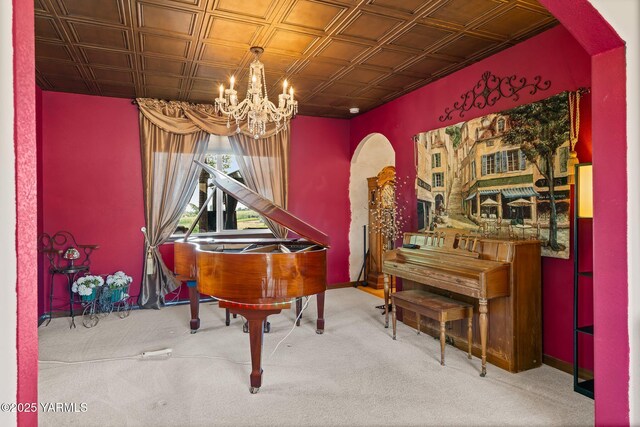 12900 Douglas Rd, Yakima, WA 98908 - sitting room featuring arched walkways, a chandelier, an ornate ceiling, carpet floors, and baseboards