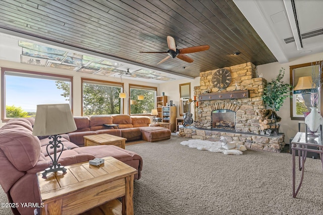 12900 Douglas Rd, Yakima, WA 98908 - living room with carpet flooring, a fireplace, a ceiling fan, and wood ceiling