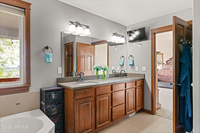 12900 Douglas Rd, Yakima, WA 98908 - ensuite bathroom featuring double vanity, tile patterned flooring, and a bathtub