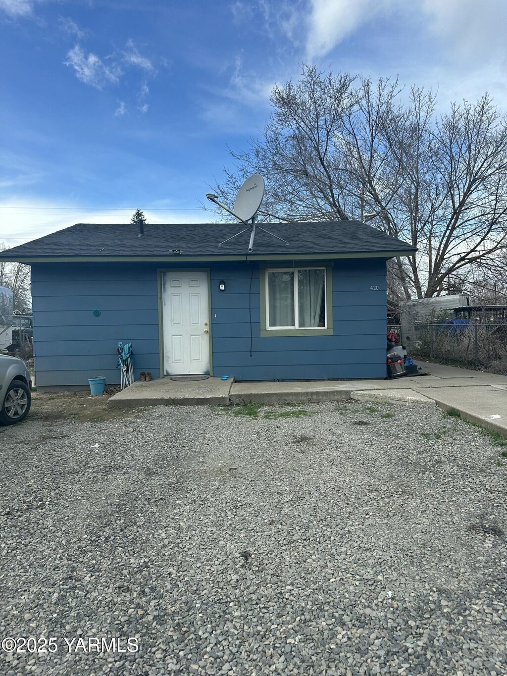 back of house featuring fence