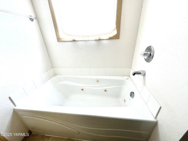 bathroom with a jetted tub