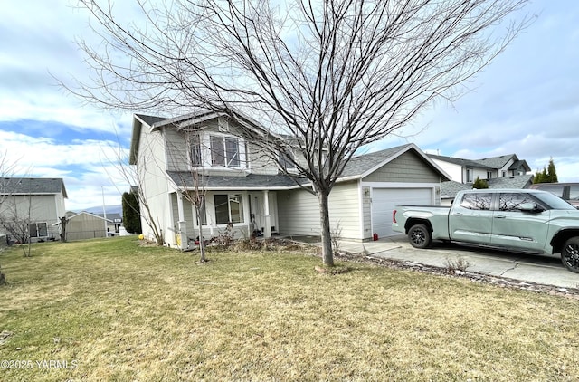 view of front facade featuring a balcony, driveway, an attached garage, and a front yard