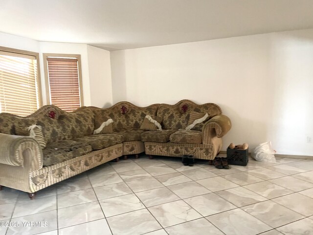 living area featuring light tile patterned floors