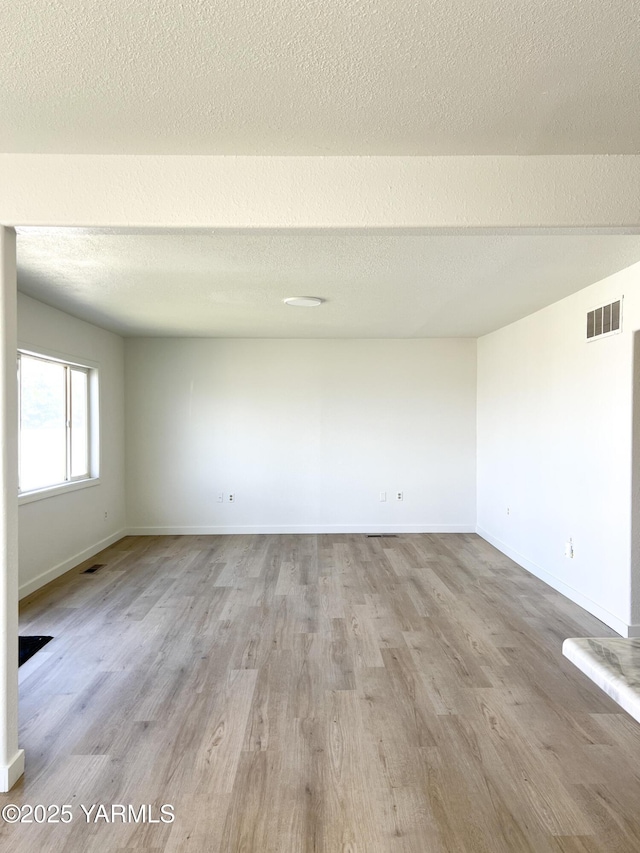 409 Elm Ave, Grandview, WA 98930 - spare room with wood finished floors and baseboards
