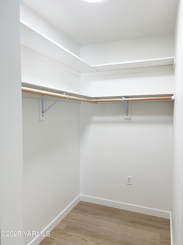 409 Elm Ave, Grandview, WA 98930 - walk in closet featuring wood finished floors