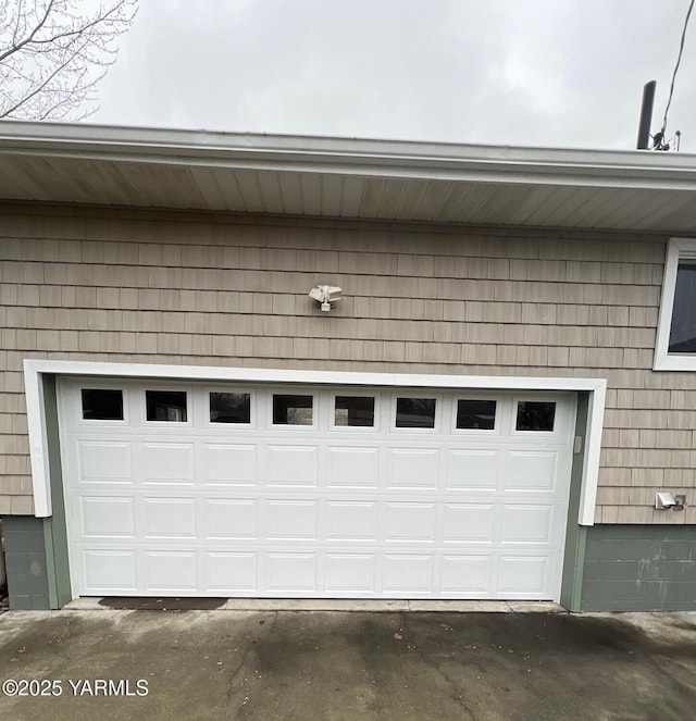 garage with aphalt driveway