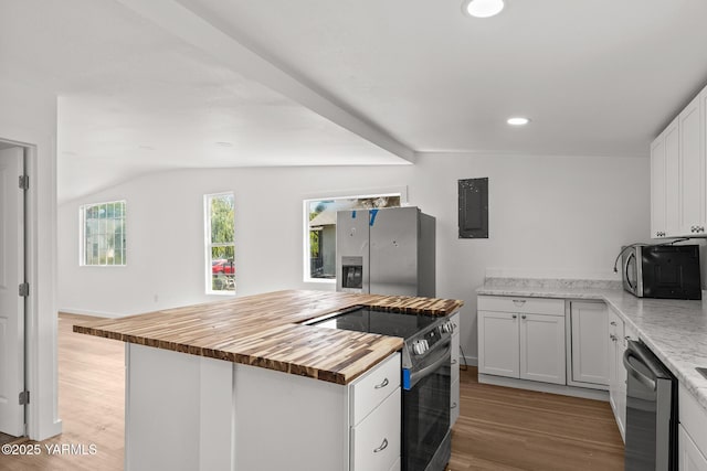 810 S 6th Ave, Yakima, WA 98902 - kitchen featuring butcher block counters, appliances with stainless steel finishes, electric panel, light wood finished floors, and recessed lighting