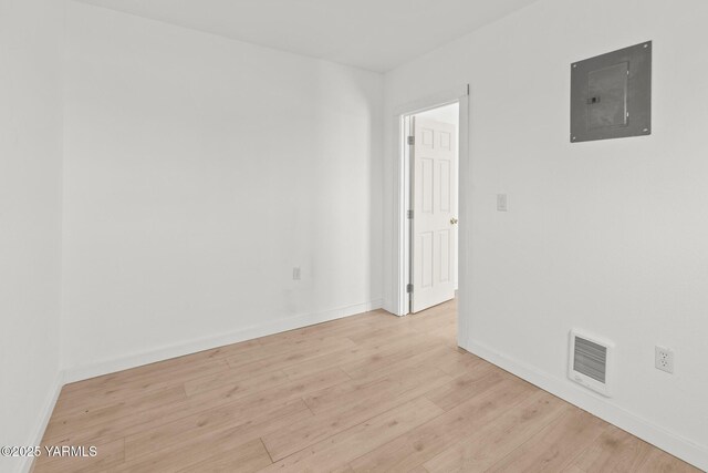 810 S 6th Ave, Yakima, WA 98902 - spare room featuring electric panel and light wood finished floors