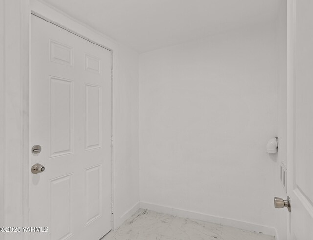 810 S 6th Ave, Yakima, WA 98902 - empty room featuring baseboards and light marble finish flooring