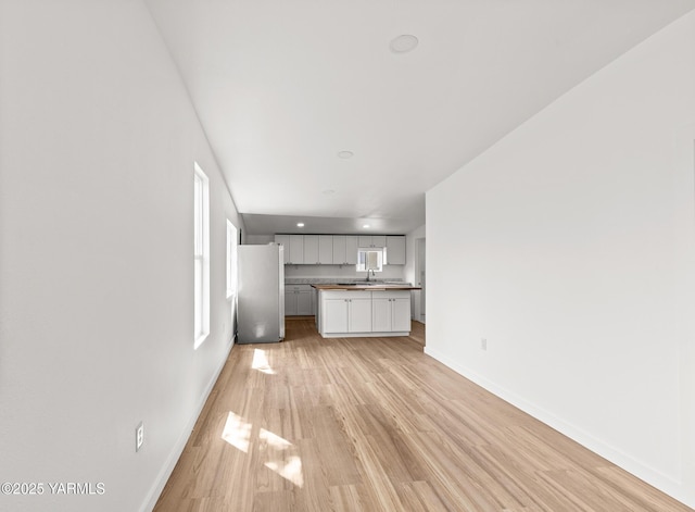 810 S 6th Ave, Yakima, WA 98902 - unfurnished living room with light wood-style floors and recessed lighting