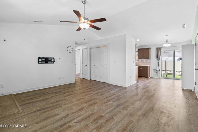 5301 Sage Way, Yakima, WA 98901 - unfurnished living room featuring a ceiling fan, light wood-type flooring, and vaulted ceiling