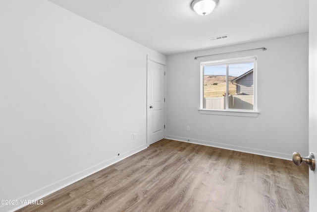 5301 Sage Way, Yakima, WA 98901 - unfurnished room with wood finished floors and baseboards