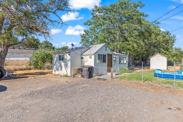 view of shed with fence