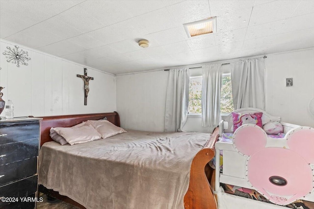 bedroom featuring visible vents