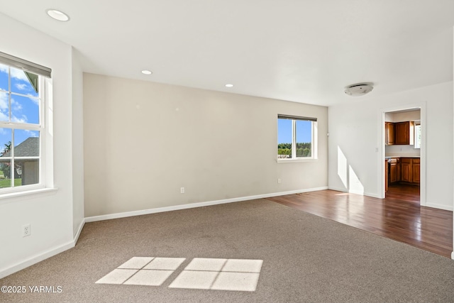 604 N 57th St, Yakima, WA 98901 - empty room featuring recessed lighting, dark colored carpet, and baseboards