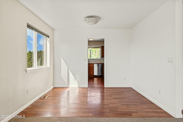 604 N 57th St, Yakima, WA 98901 - unfurnished room with visible vents, wood finished floors, and baseboards