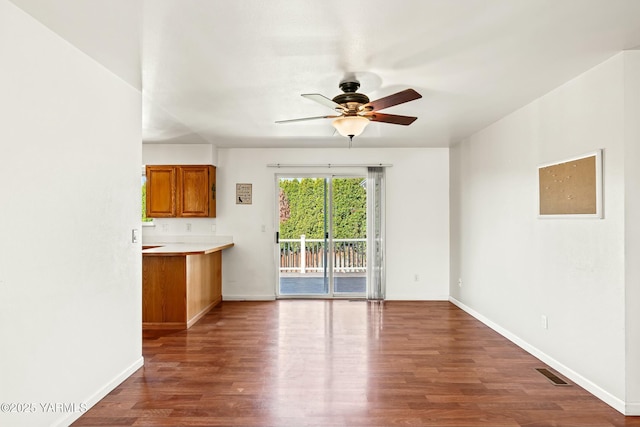 604 N 57th St, Yakima, WA 98901 - unfurnished living room with baseboards, wood finished floors, visible vents, and ceiling fan