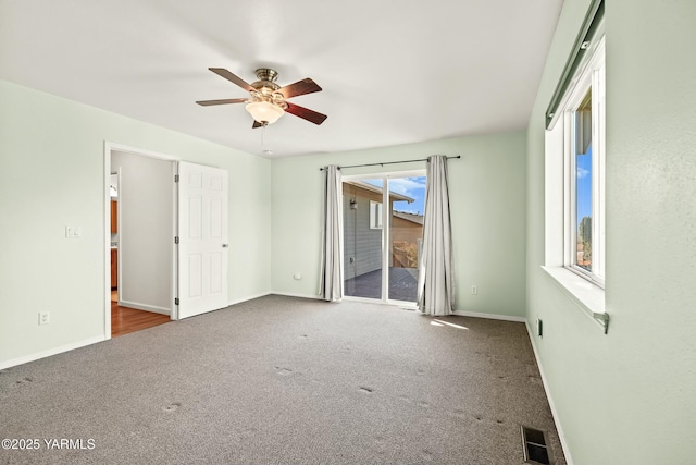 604 N 57th St, Yakima, WA 98901 - unfurnished bedroom with ceiling fan, carpet, baseboards, access to exterior, and visible vents