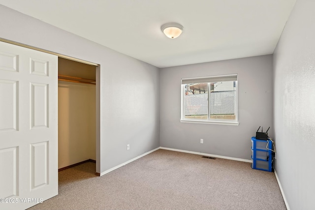 604 N 57th St, Yakima, WA 98901 - unfurnished bedroom with a closet, visible vents, carpet flooring, and baseboards